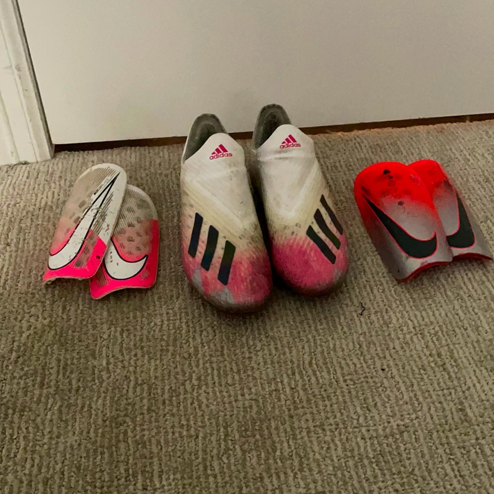 soccer cleats with two pair of shin guards!
